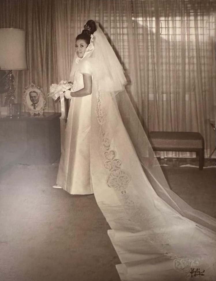 In her Ramon Valera custom wedding gown.
