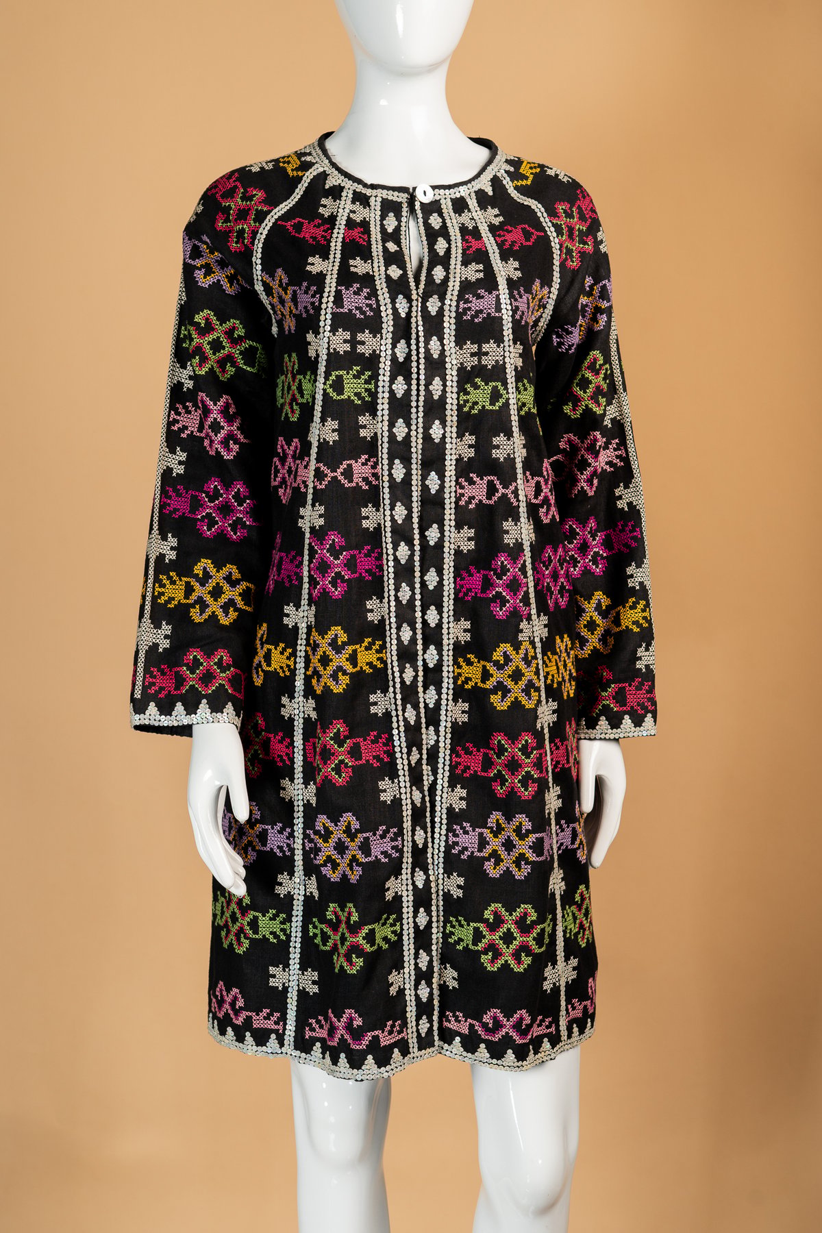 Short embellished dress by Len Cabili.