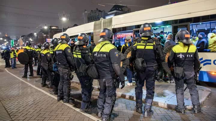 Dutch police officers stand guard after several scuffles broke out after a football match between Ajax Amsterdam and Maccabi Tel Aviv.