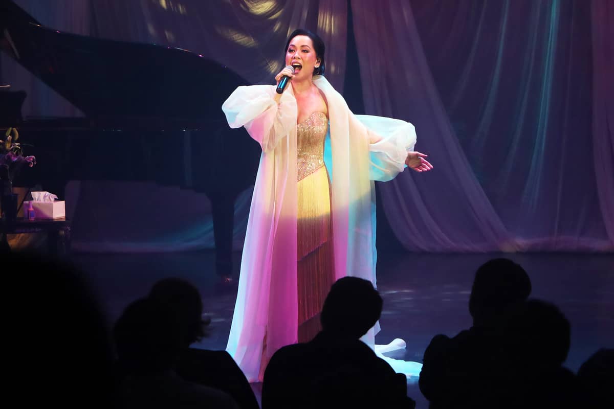The star of the night begins the performance with a transparent robed outfit.