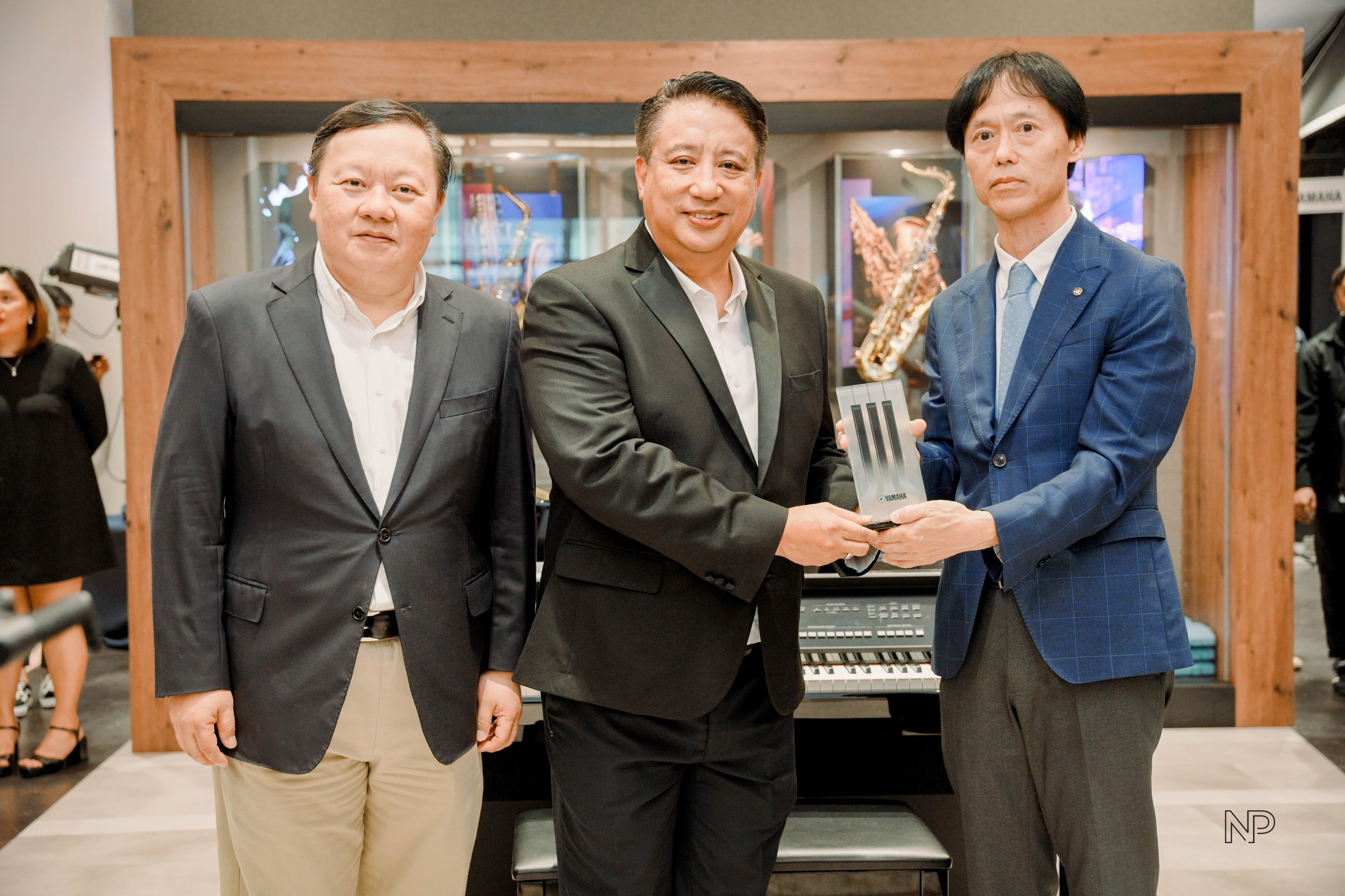 Remarkable Living managing director Ivan Yao and Yamaha Corporation senior general manager, Asia Pacific Sales Division Kennei Sakai and DepEd Undersecretary Peter Corvera.