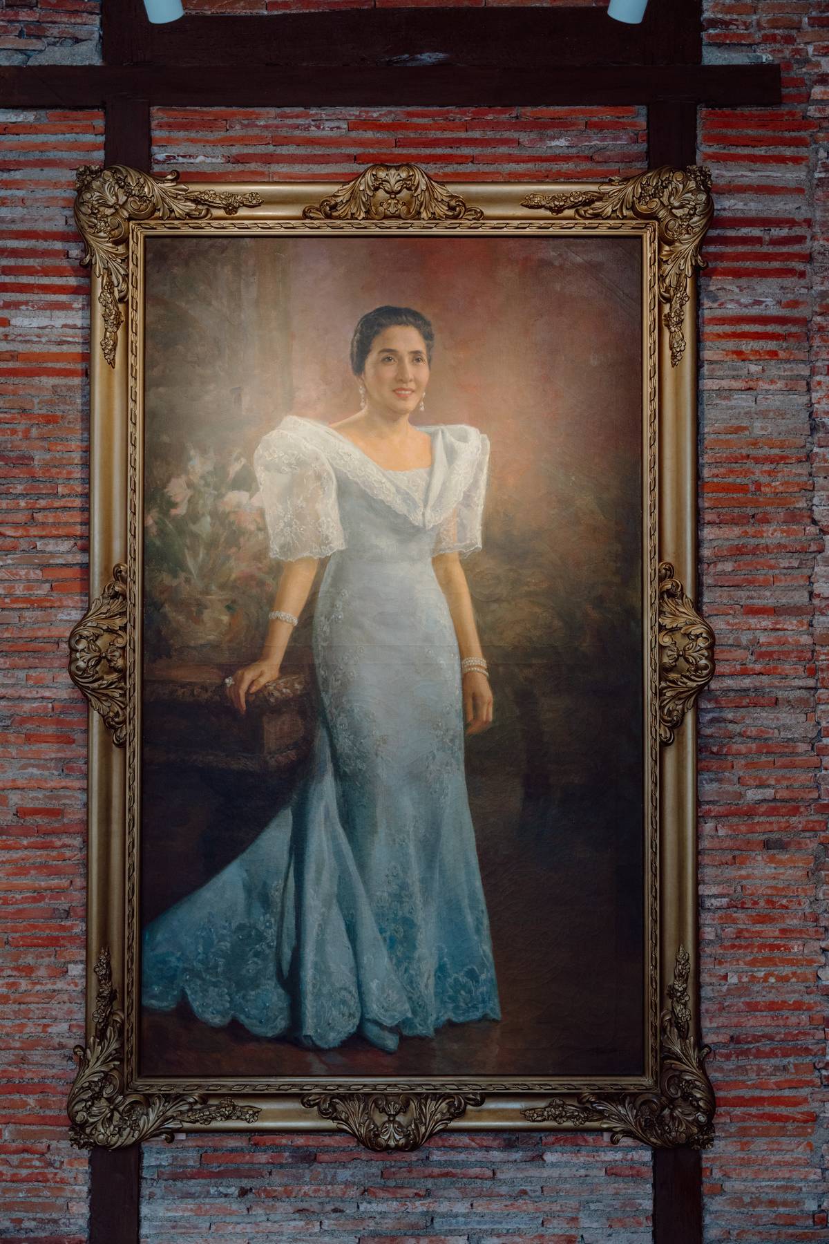 A portrait of First Lady Leonila D. Garcia by National Artist Fernando C. Amorsolo.