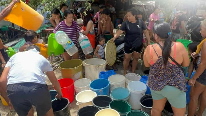 RESIDENTS of Barangay Labangon in Cebu City get water ration during a supply shortage.