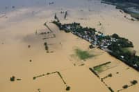 AN aerial photo captures the devastating aftermath of typhoon ‘Ofel,’ with a swollen river surging through farm fields and inundating homes in a village in Ilagan, Isabela on Tuesday. The scene is one of utter destruction, as floodwaters rage through the once-thriving landscape, leaving behind a trail of devastation.