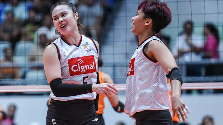 Vanie Gandler (left) and Jovelyn Fernandez celebrate as Cignal scores a 25-18, 25-21, 25-18 win over Farm Fresh in the PVL All-Filipino Conference at the Ynares Center.