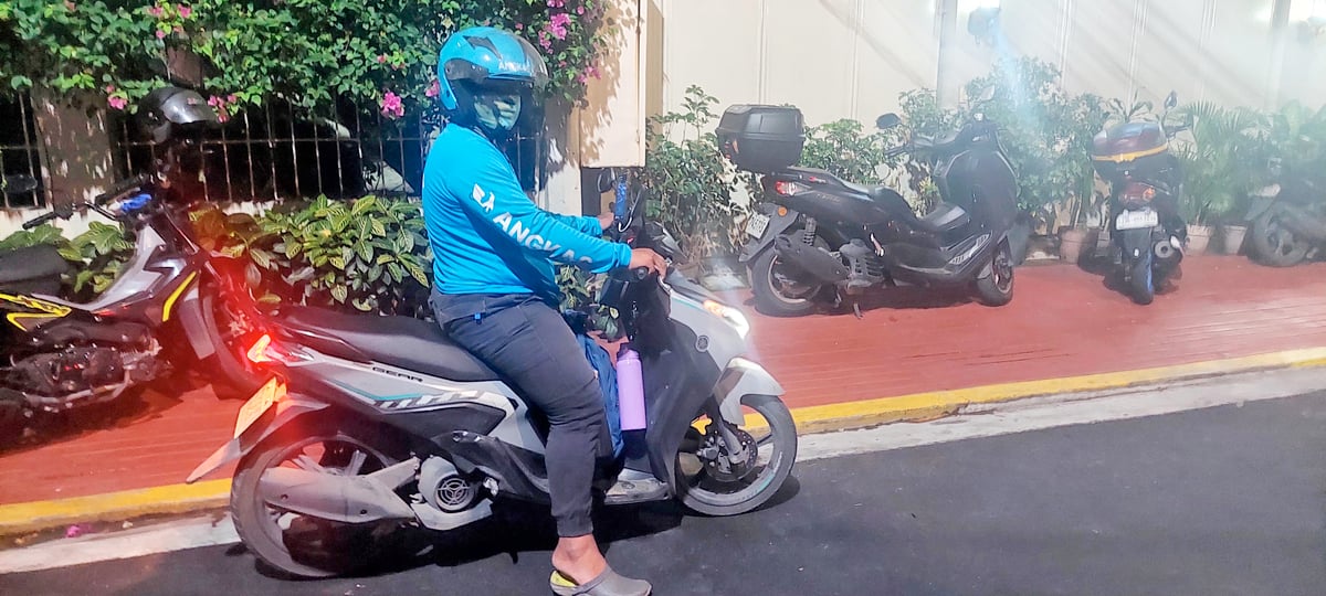 KINGS OF THE ROAD: Motorcycle taxis give passengers royal treatment