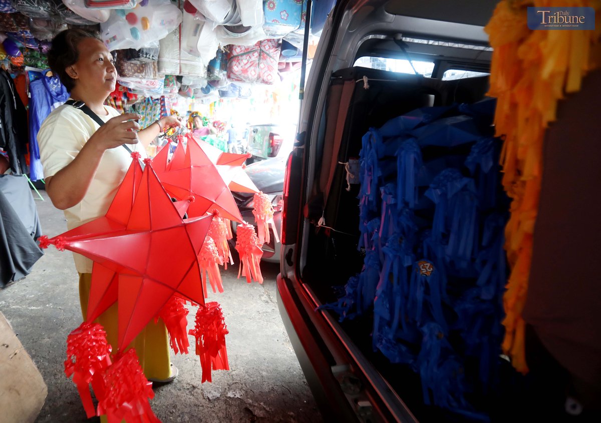 With 37 days until Christmas, customers shop for colorful traditional parols at Mega Q Mart in Quezon City on Monday, 18 November 2024.