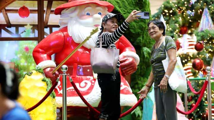 With 34 days until Christmas, mallgoers take photos and selfies at the festive Christmas display at SM North Edsa on Thursday, 21 November 2024.