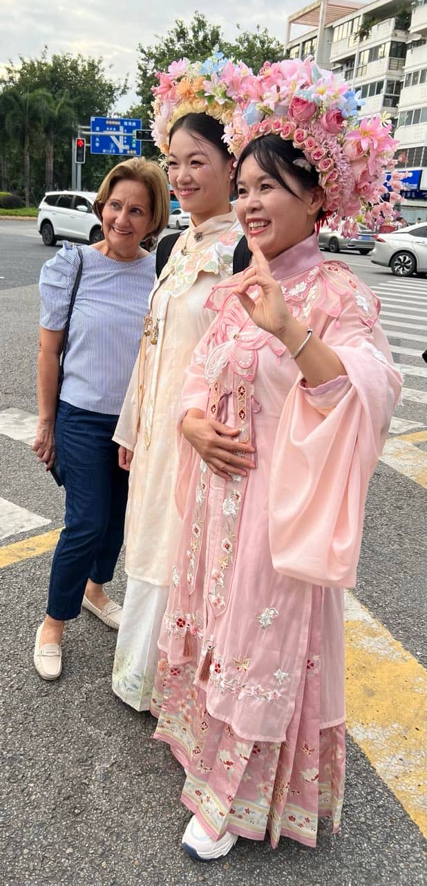 Traditional wear: Honey Jarque Loop with two young ladies at the Xiamen University.