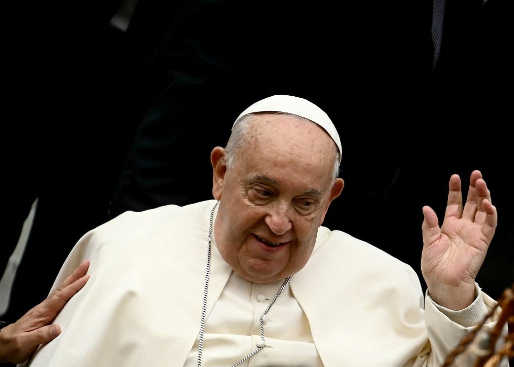 Pope Francis acknowledges the pilgrims as he arrives to lead an audience to Italian fishermen and participants to the National health services in Europe congress, promoted by Cei (Italian episcopal Conference), at Paul VI hall in the Vatican on 23 November, 2024.