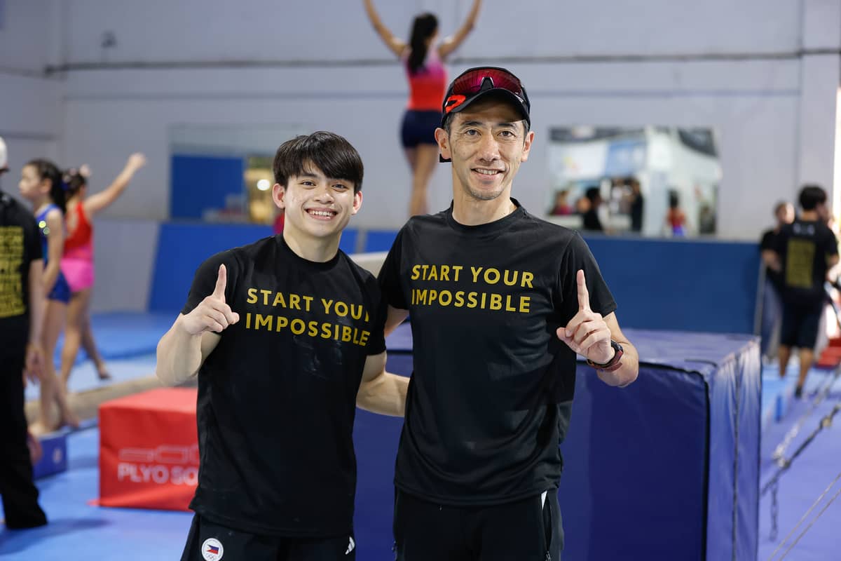TMP president Masando Hashimoto with Yulo at the Gymnastics Camp.