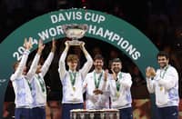 JANNIK Sinner (middle) raises the trophy after leading Italy to its successful defense of the Davis Cup title in Malaga, Spain.