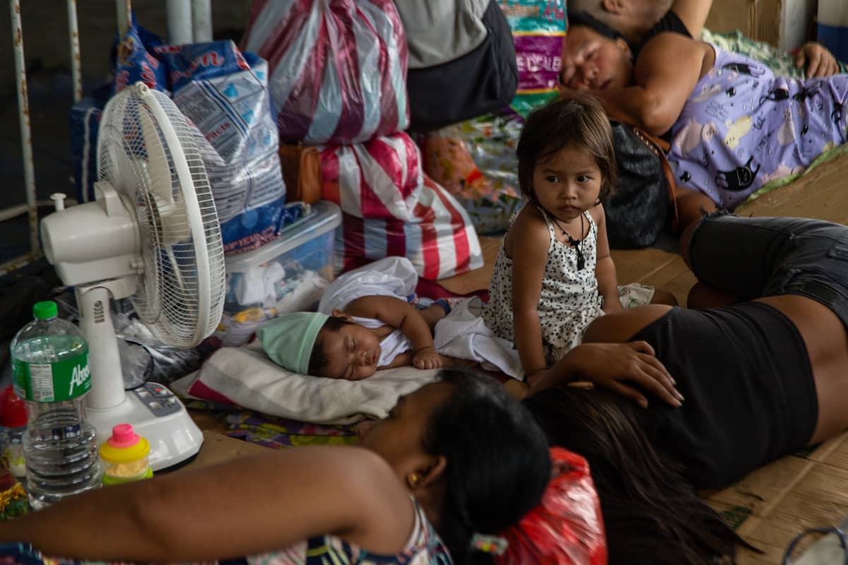 Thousands of families displaced by the Islang Puting Bato fire seek shelter at the Delpan Evacuation Center in Tondo, Manila, on Monday, 25 November.
