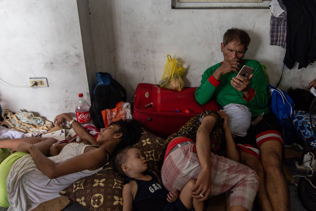 Thousands of families displaced by the Islang Puting Bato fire seek shelter at the Delpan Evacuation Center in Tondo, Manila, on Monday, 25 November.
