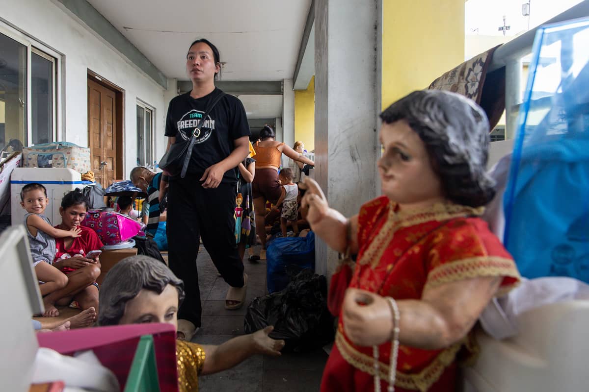 Thousands of families displaced by the Islang Puting Bato fire seek shelter at the Delpan Evacuation Center in Tondo, Manila, on Monday, 25 November.