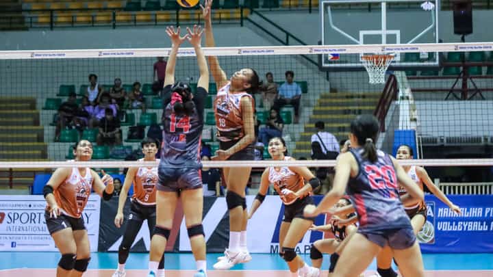 Cristy Ondangan of Quezon soars for an attack over the defense of Jen Villegas of Biñan during Game 1 of their MPVA best-of-three title series late Monday at the Alonte Sports Arena in Biñan City.