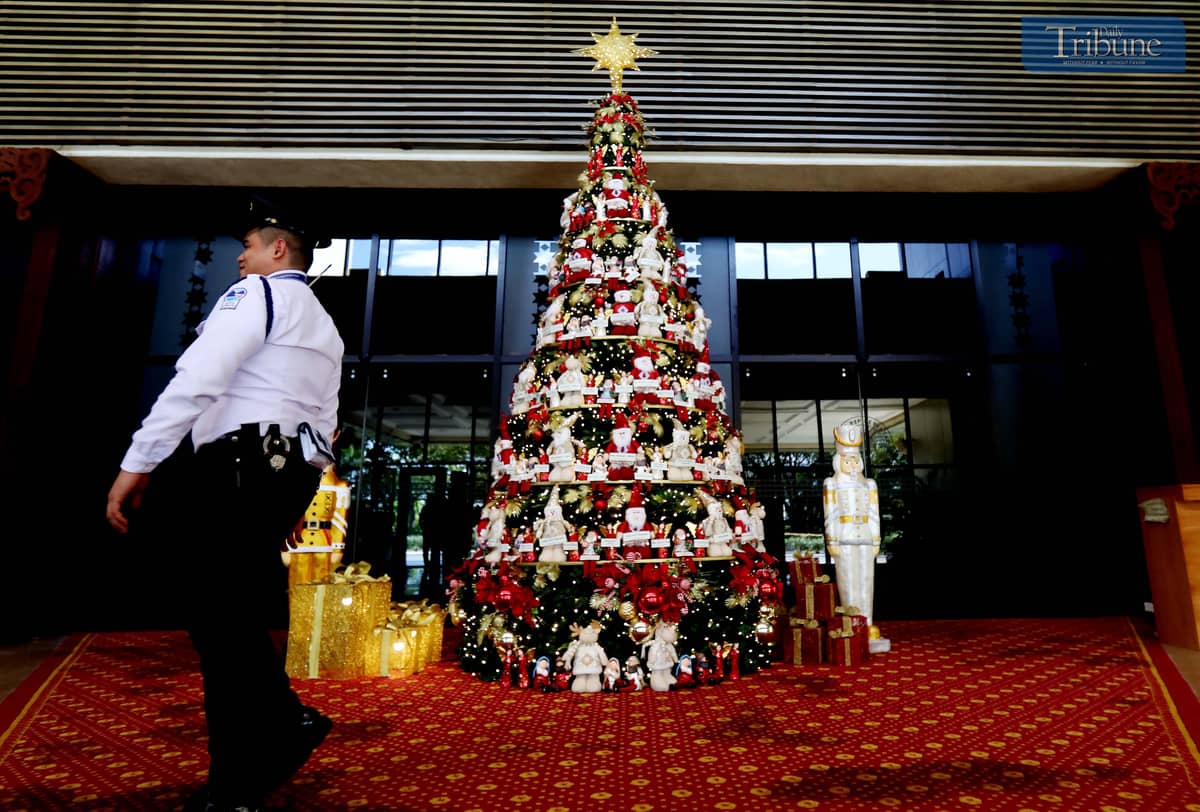A giant Christmas tree adorned with the names of President Ferdinand "Bongbong" Marcos Jr., First Lady Liza Araneta Marcos, and lawmakers stands at the main entrance of the plenary hall.