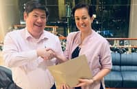 Mikee Cojuangco-Jaworski (right) hands a sealed envelope containing her vote to POC election committee chairman Teodoro Kalaw IV ahead of the POC polls on Friday.