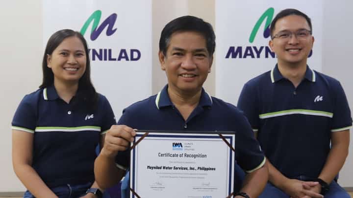 LOOK: Maynilad Chief Sustainability Officer Atty. Roel S. Espiritu (center) holds the certificate of recognition given to Maynilad by the International Water Association (IWA) for being one of 28 “climate smart” utilities worldwide cited during the 2024 IWA Climate Smart Utilities Recognition. With Espiritu are (from left) Sustainability Assistant Manager Apple Joy Albero and Sustainability Head John Emmanuel Martinez. Maynilad was recognized for its for its innovative strategies to mitigate and adapt to the impacts of climate change.