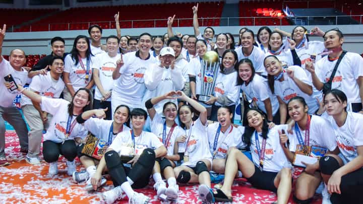 Quezon Gov. Helen Tan (middle) lifts the trophy after the Tangerines completed a sweep of Biñan in the 2024 Maharlika Pilipinas Volleyball Association best-of-three finals series late Wednesday at the Quezon Convention Center.