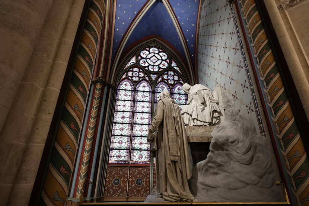This photograph shows a statue and windows inside Notre-Dame de Paris cathedral in Paris, on November 29, 2024. The Notre-Dame Cathedral is set to re-open early December 2024, with a planned weekend of ceremonies on December 7 and 8, 2024, five years after the 2019 fire which ravaged the world heritage landmark and toppled its spire. Some 250 companies and hundreds of experts were mobilised for the five-year restoration costing hundreds of millions of euros.