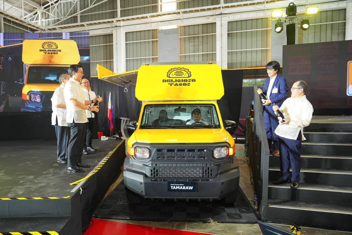 Toyota Motor Philippines (TMP) Chairman Alfred Ty (from right, top to bottom) leads the ceremonial pouring of champagne on a Next Generation Tamaraw unit during the roll-off ceremony in Sta. Rosa, Laguna. In photo are (from left, back to front) Toyota Asia Region Deputy Chief Executive Officer Hao Quoc Tien, TMP Vice Chairman David Go, Embassy of Japan in the Philippines Economic Minister Daisuke Nihei, and Philippine Economic Zone Authority Director General Tereso Panga.