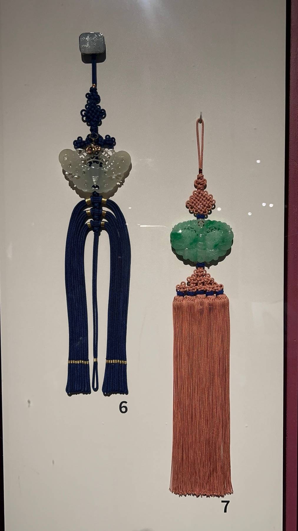 Pendant with jade butterfly ornament.