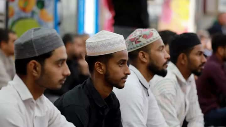 Foreign workers in Iraq attend prayers at Baghdad's Abdul Qader al-Jilani mosque. The country, better known for its own exodus of refugees, is home to hundreds of thousands.