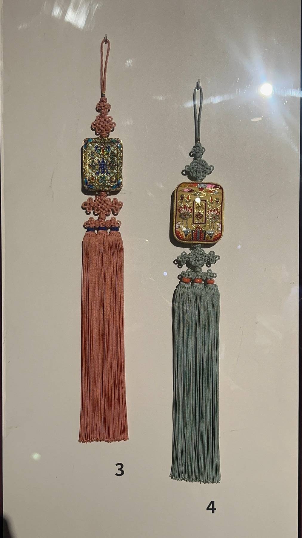 Pendant with embroidered perfume case.