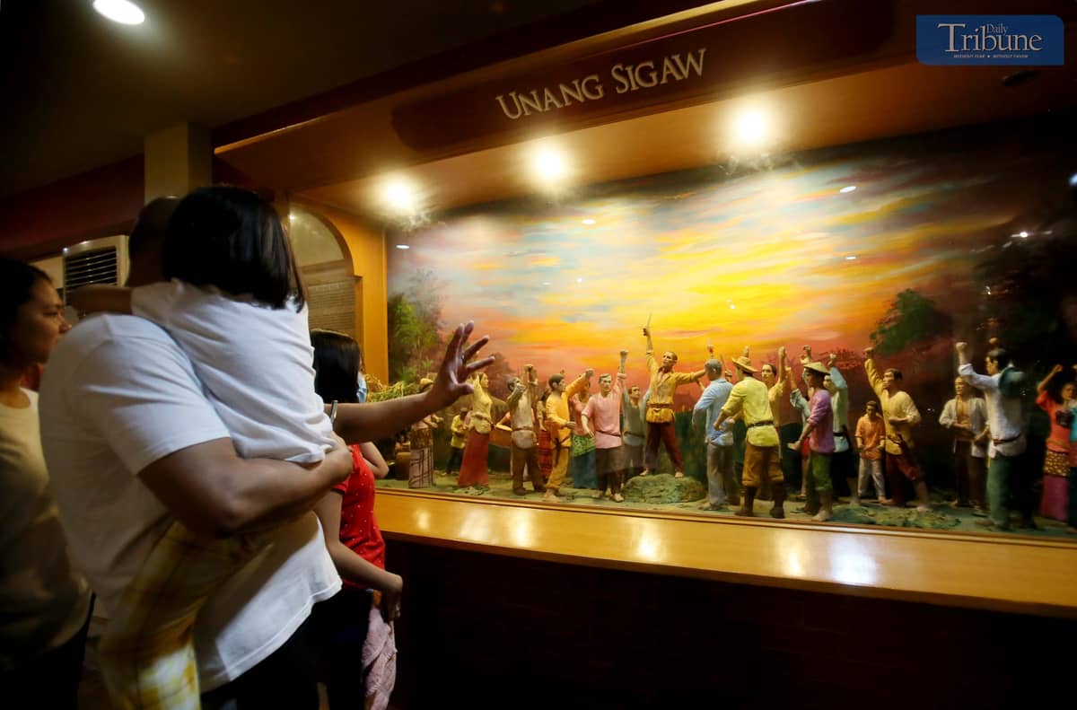 Parents bring their children to the Museo ng Katipunan in San Juan City on Saturday, 30 November.