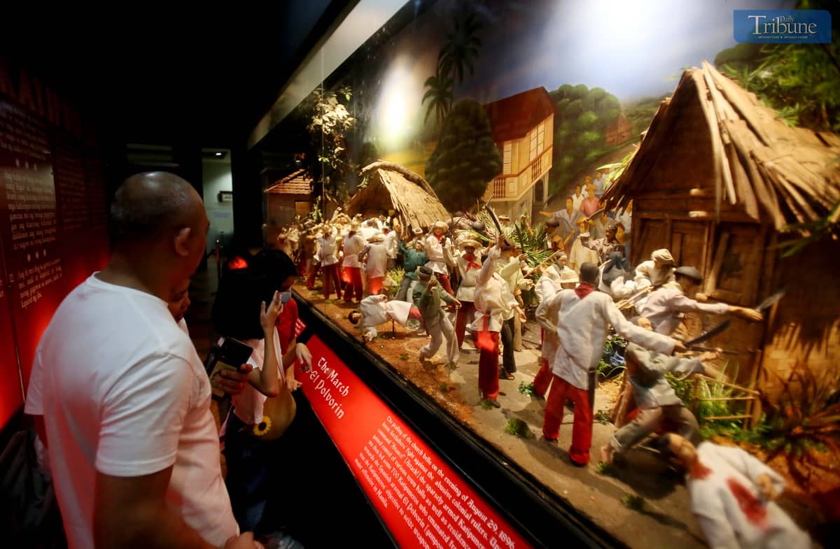 Parents bring their children to the Museo ng Katipunan in San Juan City on Saturday, 30 November.