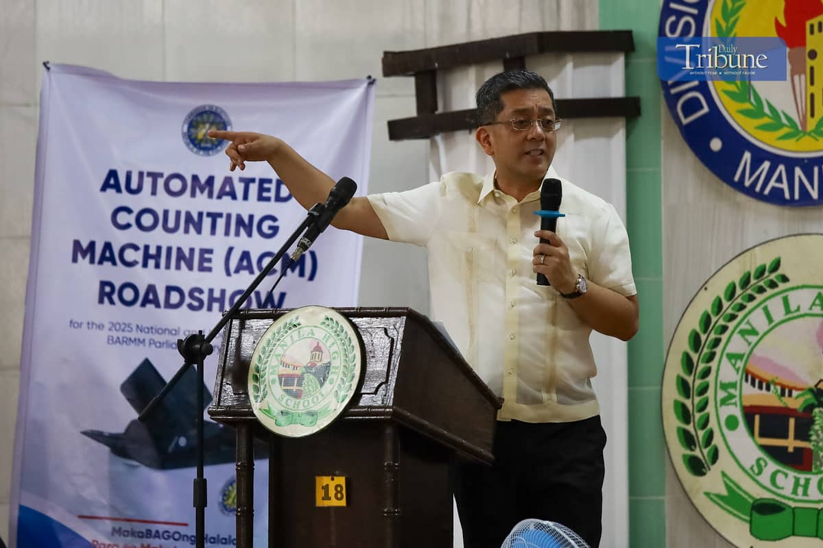 Comelec Chairman George Erwin Garcia kicks off the nationwide Automated Counting Machine (ACM) roadshow at Manila High School in Intramuros, Manila, on Monday, 2 December. The new ACMs are set to debut in the 2025 midterm elections and subsequent polls.