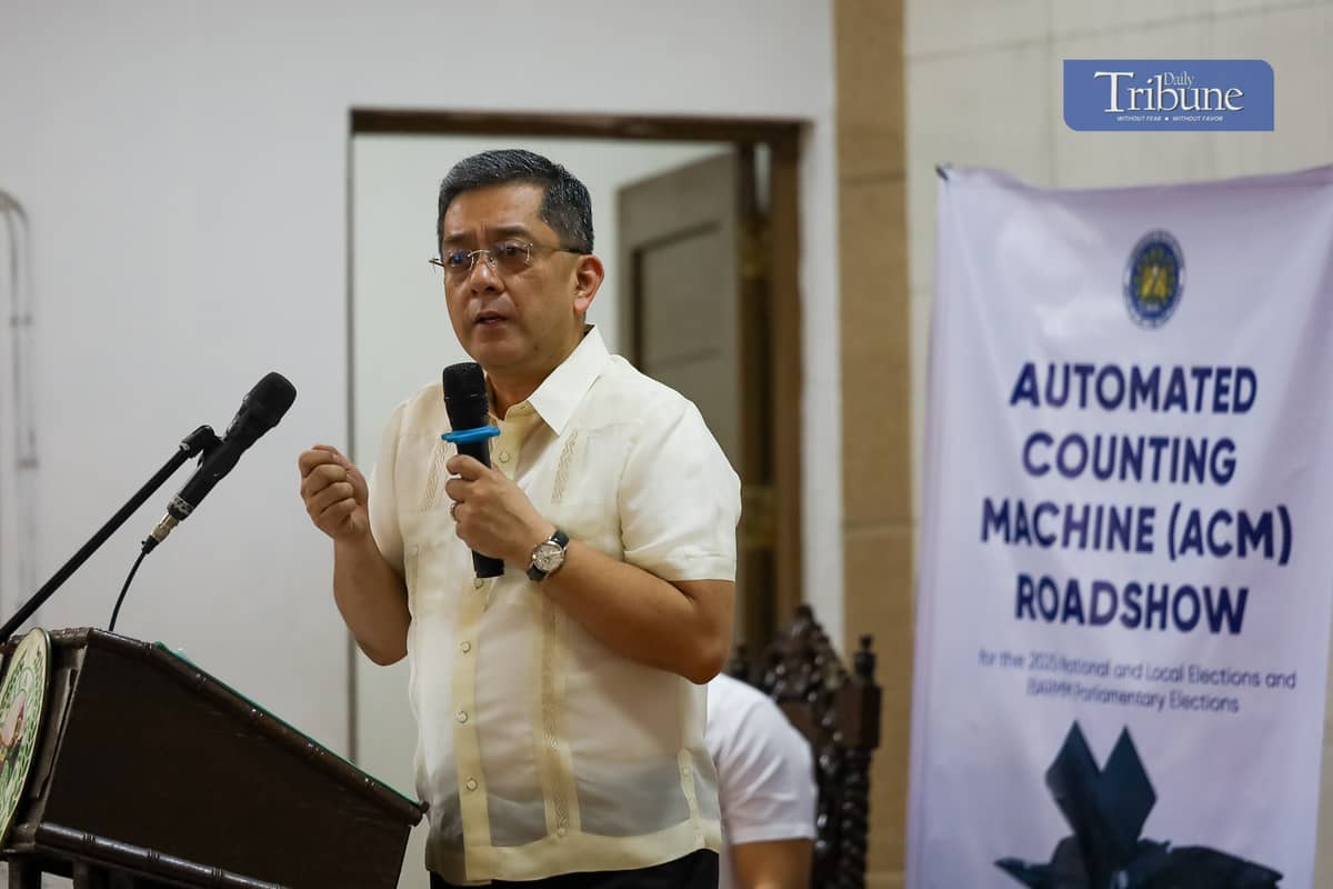 Comelec Chairman George Erwin Garcia kicks off the nationwide Automated Counting Machine (ACM) roadshow at Manila High School in Intramuros, Manila, on Monday, 2 December. The new ACMs are set to debut in the 2025 midterm elections and subsequent polls.