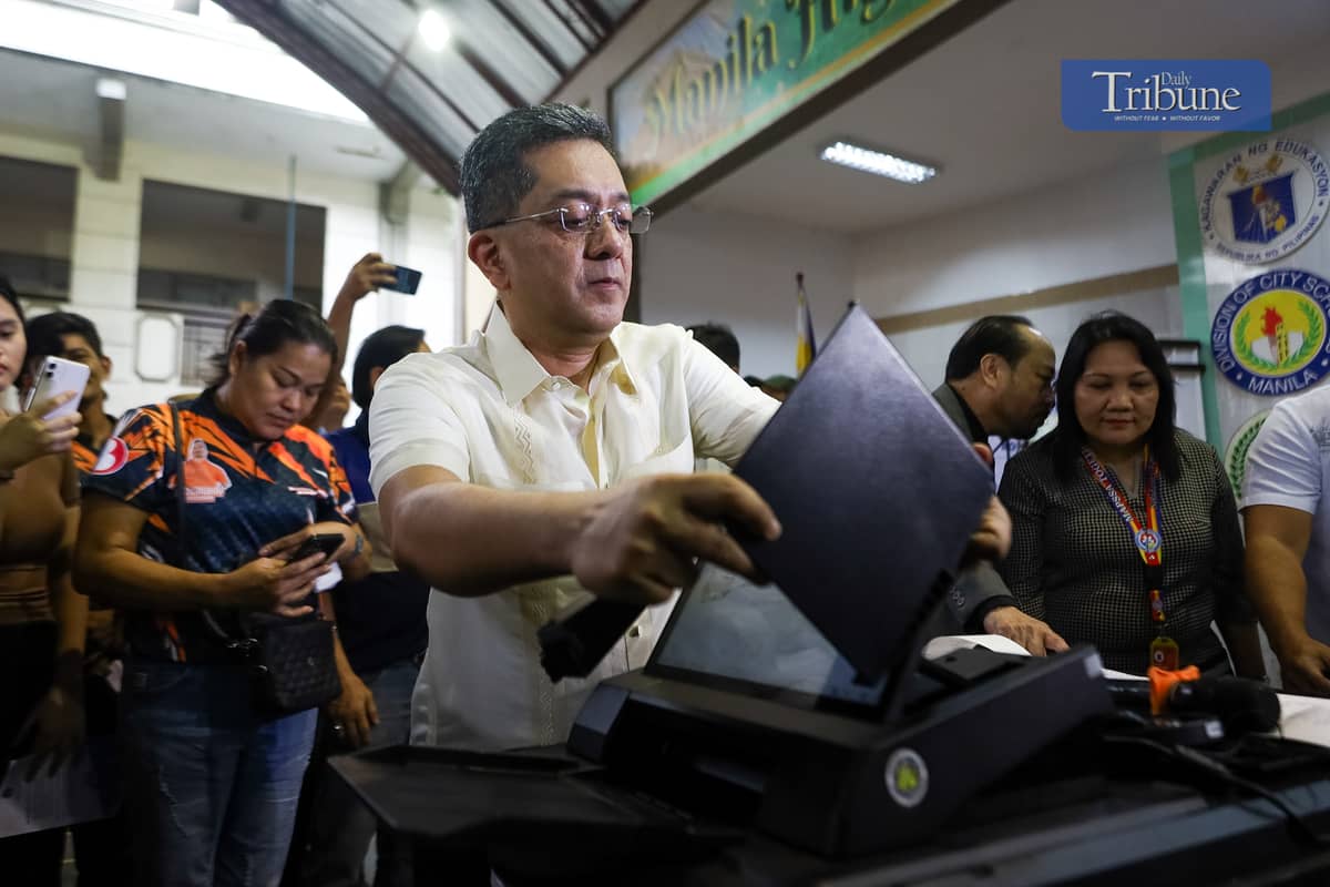 Comelec Chairman George Erwin Garcia kicks off the nationwide Automated Counting Machine (ACM) roadshow at Manila High School in Intramuros, Manila, on Monday, 2 December. The new ACMs are set to debut in the 2025 midterm elections and subsequent polls.