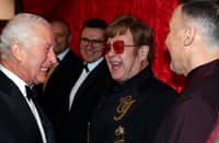 Britain's King Charles III reacts as he meets Elton John (2R) and David Furnish (R) as he attends the Royal Variety Performance at the Royal Albert Hall in London on 22 November 2024. The Royal Variety Performance takes place every year in aid of the Royal Variety Charity. The money raised from the show helps hundreds of entertainers throughout the UK, who need help and assistance.