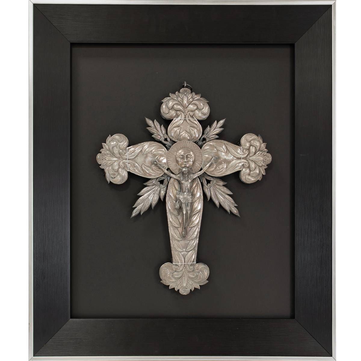 ‘A lustrous silver processional cross in frame,’ 19th century, estimated P300,000 to P400,000.