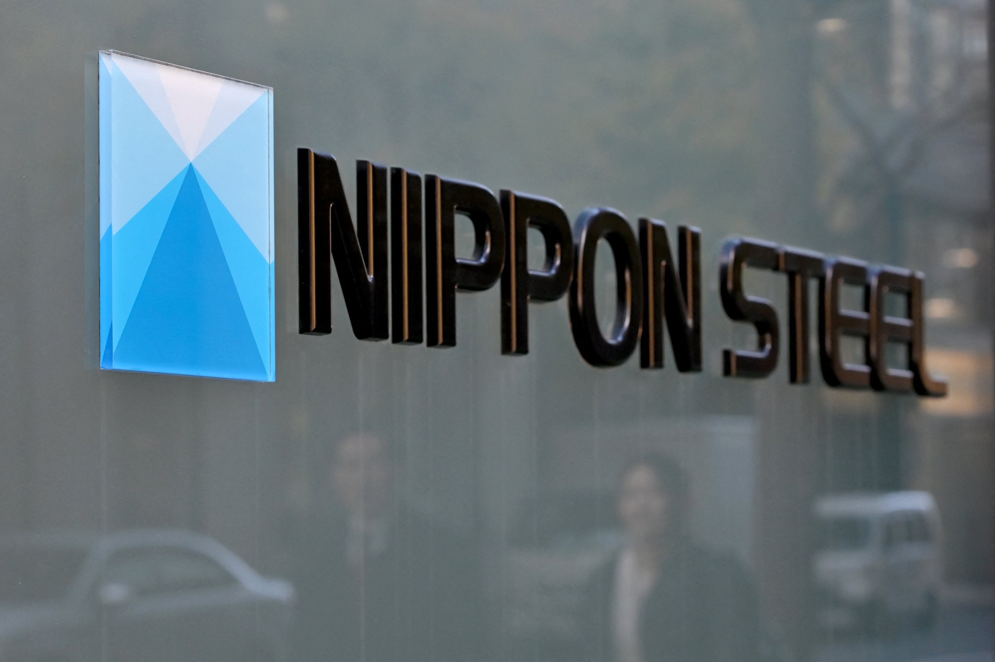 The logo of Nippon Steel Corp. is seen at an office building where the company's head office in Tokyo on December 19, 2023. US President-elect Donald Trump on December 2, 2024 said he would "block" a planned takeover of US Steel by Japanese company Nippon Steel, a deal worth $14.9 billion including debts.
Kazuhiro NOGI / AFP