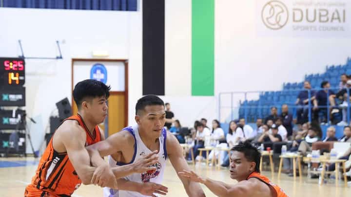 Justine Baltazar of Pampanga penetrates the defense of Ximone Sandagon and L-Jay Gonzales of Quezon Province during Game 2 of their MPBL Sixth Season National Finals best-of-five series late Tuesday in Dubai. The Giant Lanterns prevailed, 79-60.