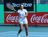 Madis prevails, reaches quarters
