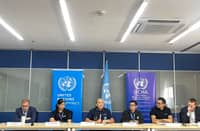 Representatives from the United Nations and its affiliated agencies discuss the impact of the six consecutive typhoons in the Philippines during a press conference.