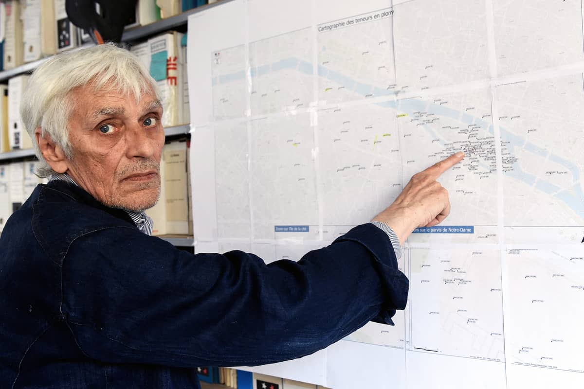 pokesperson of the 'Robin des Bois' association for environmental protection, Jacky Bonnemains shows a cartography of lead content on the Notre Dame cathedral site, in Paris, on 29 July 2019.