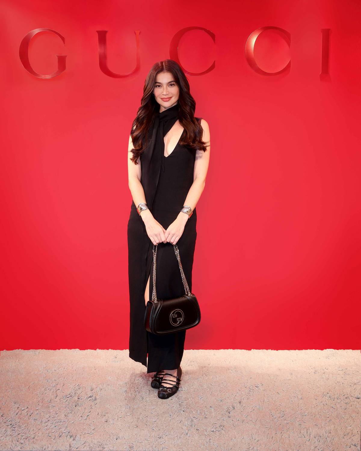 Anne Curtis-Smith wore a Gucci Cruise 2025 black, sleeveless, V-neck, acetate viscose marocaine long dress with attached scarf, Gucci Blondie mini shoulder bag and women’s Gucci Horsebit ballet flat.