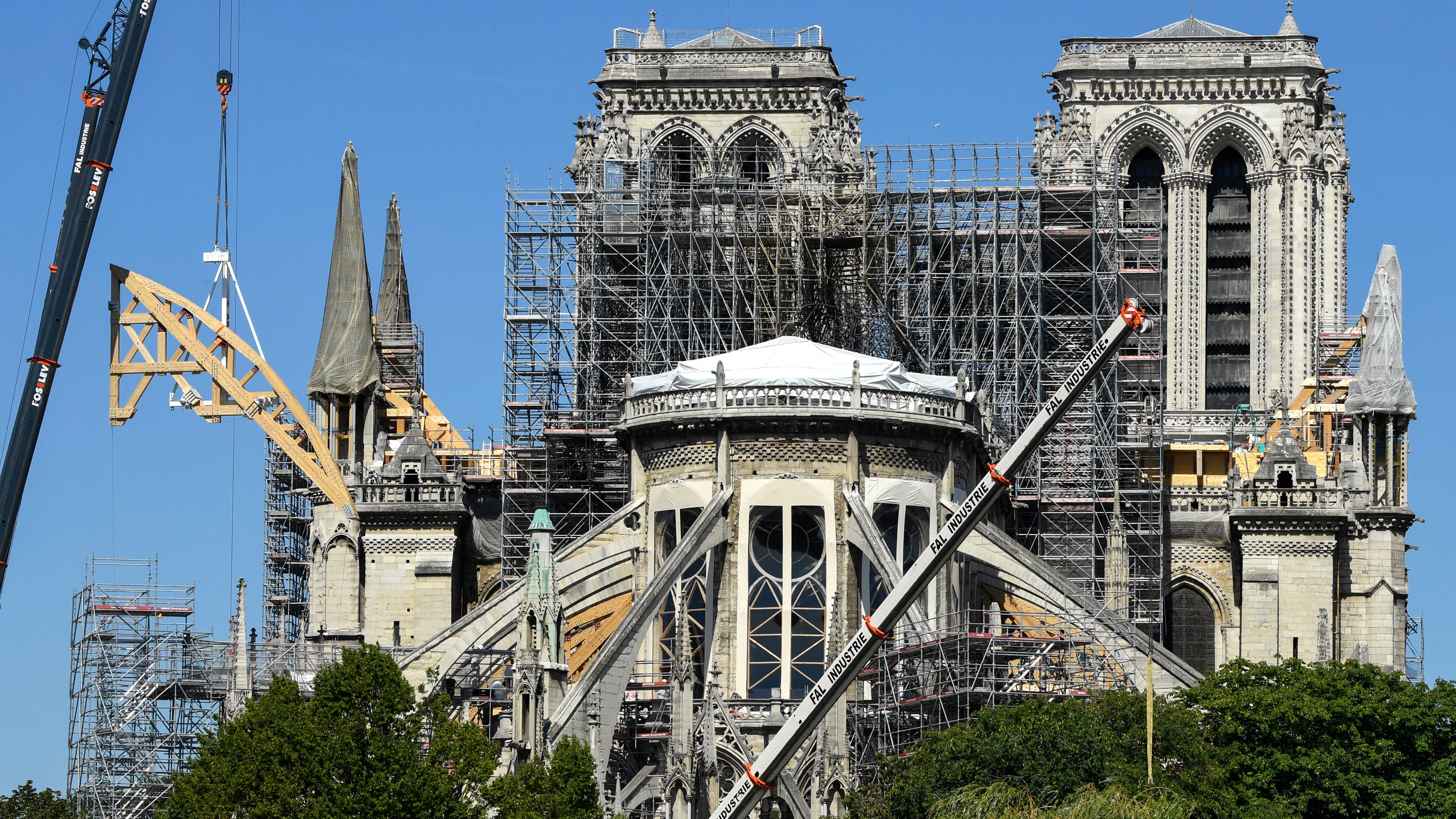 This picture, taken on 9 July 2019 in Paris, shows the Notre-Dame de Paris cathedral during ongoing reconstruction work after it was badly damaged by a massive fire on 15 April 2019.