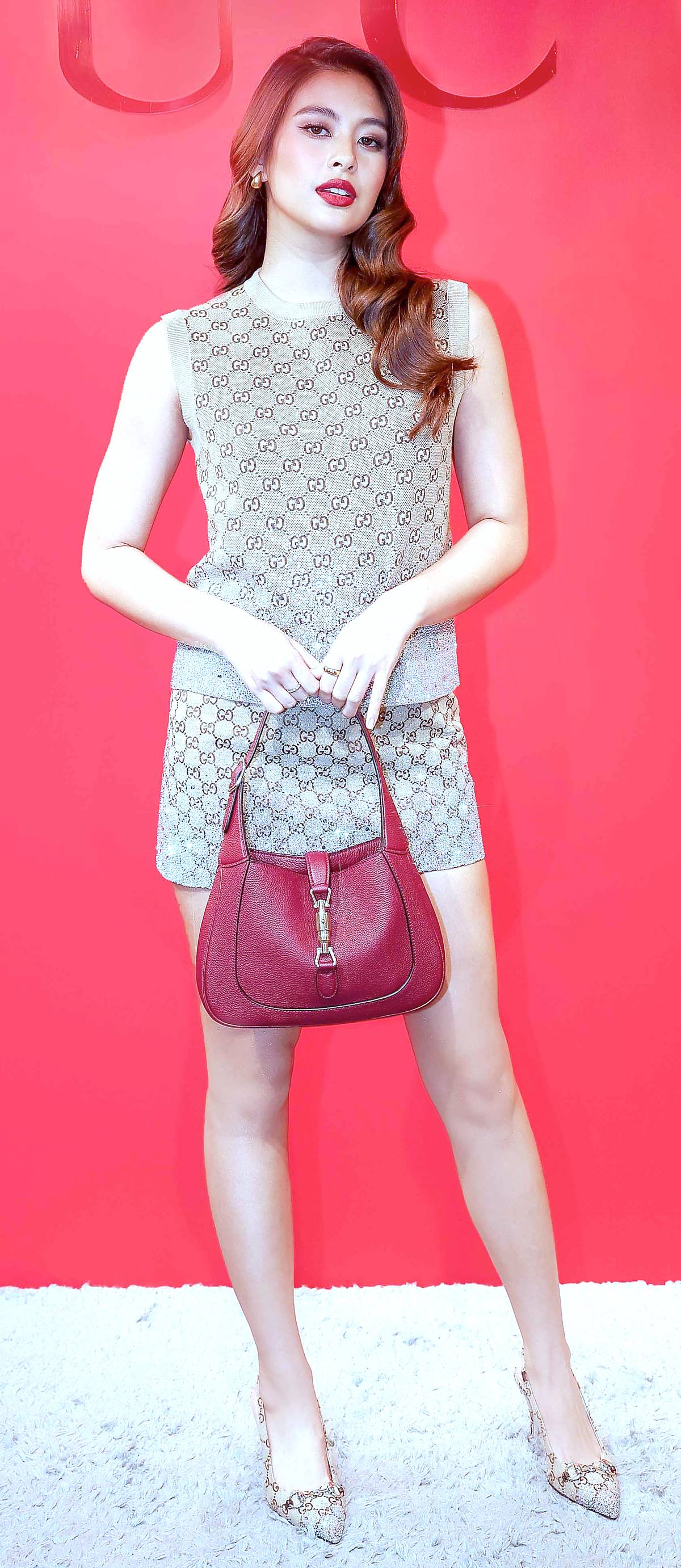 Gabbi Garcia wore a Gucci Cruise 2025 embroidered wool GG jacquard vest, GG canvas mini skirt, Gucci Jackie 1961 small shoulder bag, and women’s Gucci Horsebit pump.