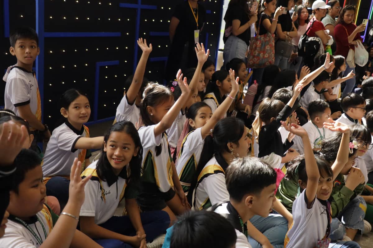 Children eager to participate in the pre-show games.