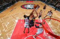 WASHINGTON, DC - 7 DECEMBER: Nikola Jokic #15 of the Denver Nuggets drives to the basket during the game against the Washington Wizards at Capital One Arena in Washington, DC.