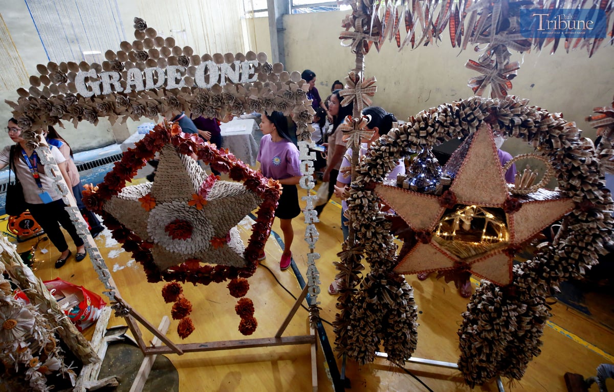 Teachers and students at Payatas B Elementary School in Quezon City craft parols from recycled materials for their eco-friendly Christmas celebration on Tuesday, 10 December 2024.