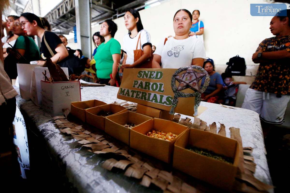 Teachers and students at Payatas B Elementary School in Quezon City craft parols from recycled materials for their eco-friendly Christmas celebration on Tuesday, 10 December 2024.