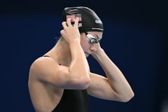 Records fall as world swim meet fires off