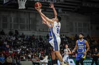 Calvin Oftana soars to a 42-point performance during TNT Tropang Giga’s 103-100 win over Magnolia in the PBA Commissioner’s Cup last night at the Ninoy Aquino Stadium.